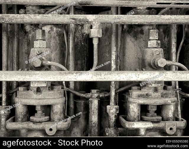 monochrome close up image of an old rusting engine