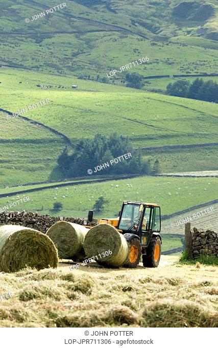 England, North Yorkshire, Burnsall. Harvesting near Burnsall in the Yorkshire Dales