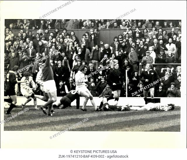 Dec. 10, 1974 - Cambridge Wins Varsity Match Rugby: A.J. Hignell of Cambridge University (right) lies prone on the ground at Twickenham, London, Tuesday, Dec