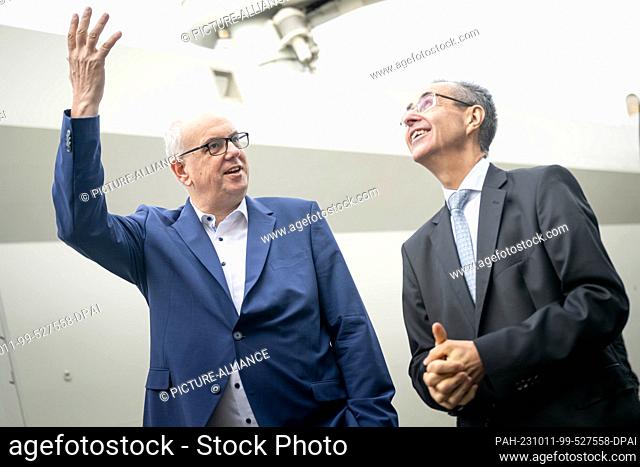 11 October 2023, Bremen: Andreas Bovenschulte (SPD, l), mayor of Bremen, and Pierre Godart, Ariane Group's head of Germany, stand on the ""Canopee"" ship