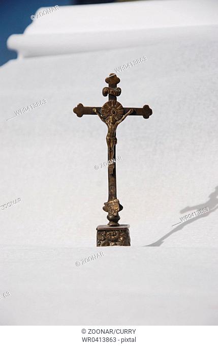 Cross on a scroll/ life and suffering
