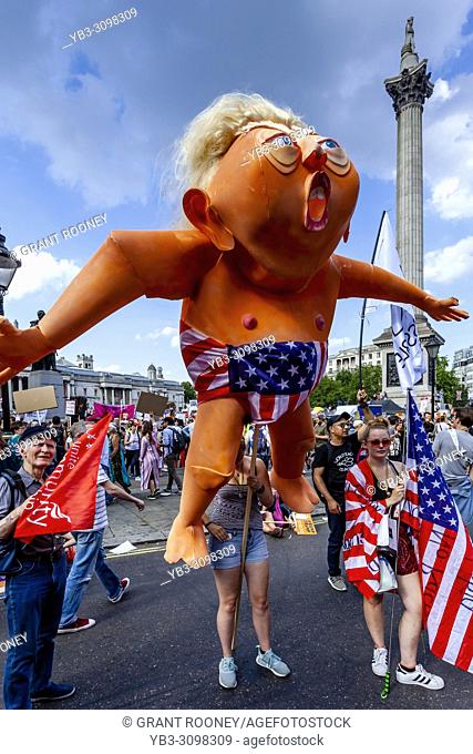 An Anti Trump Protestor Holding An Effigy Of President Trump During A Protest, Trafalgar Square, London, England