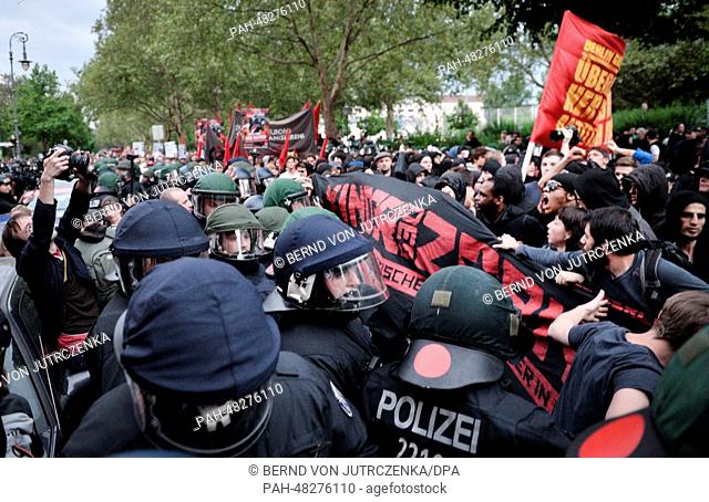 People take part in the May Day demonstration go up against police officers in Berlin-Kreuzberg, Germany, 01 May 2014. The protest by left and leftist radical...