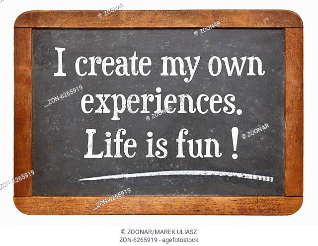 I create my own experiences. Life is fun! Positive affirmation words on a vintage slate blackboard