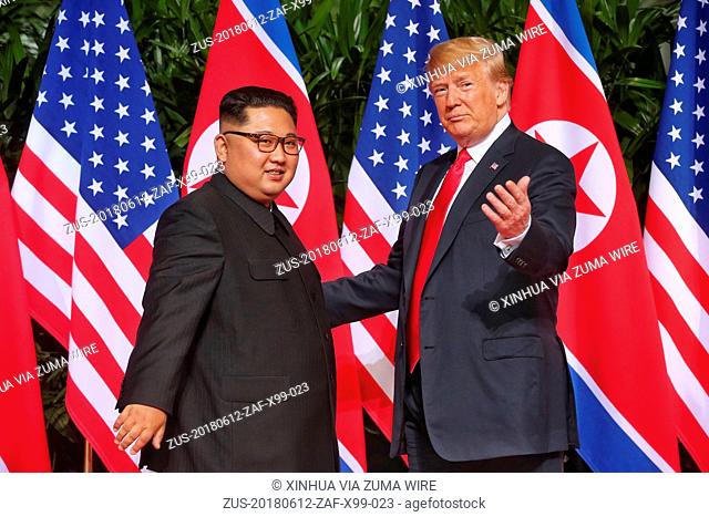 June 12, 2018 - Singapore - Top leader of the Democratic People's Republic of Korea (DPRK) KIM JONG UN (L) meets with U.S