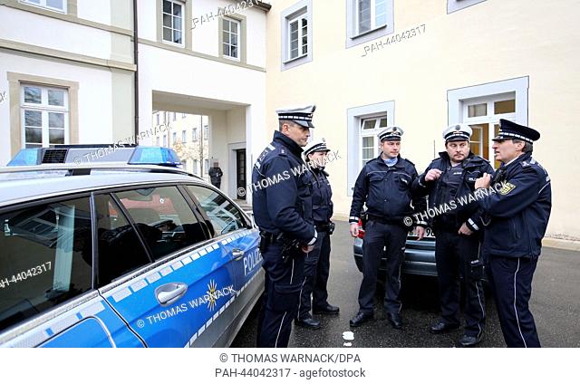 Police men stand in front of the Center for Psychiatry in Zwiefalt, Germany, 13 November 2013. At night to criminals escaped from the secure unit of the center