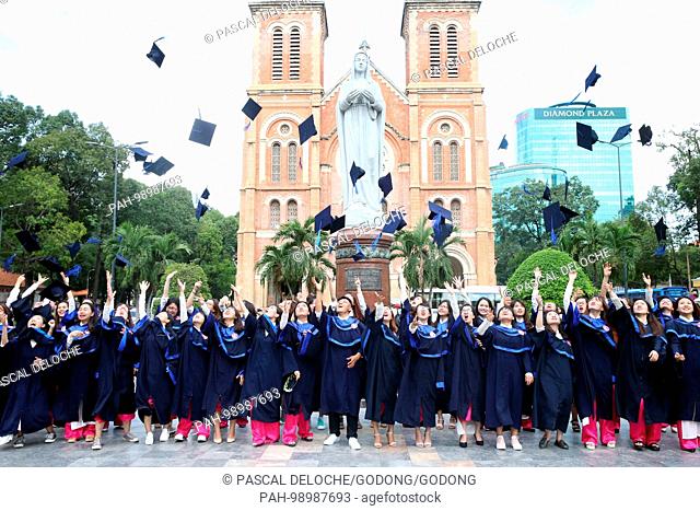 Group of Young Asian university students wearing cap and gown. Ho Chi Minh City. Vietnam. | usage worldwide. - Ho Chi Minh City/Vietnam