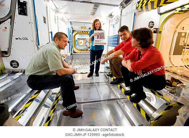 Russian cosmonaut Dmitry Kondratyev (left), Expedition 26 flight engineer and Expedition 27 commander; NASA astronaut Catherine Coleman (right foreground) and...