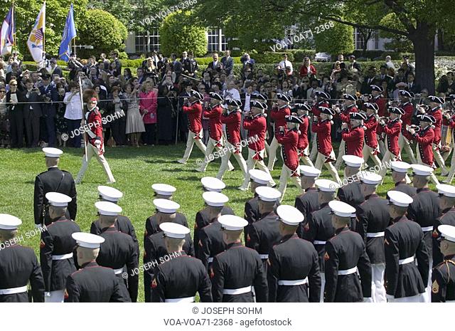 The U.S. Army Old Guard Fife and Drum Corps marching across the South Lawn during the Arrival Ceremony for Her Majesty Queen Elizabeth II and His Royal Highness...