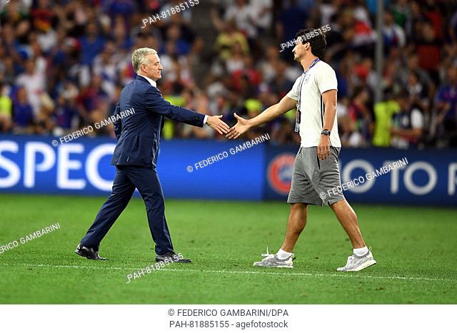 Germany's Mats Hummels (R) and coach Didier Deschamps of France shake hands duirng the UEFA EURO 2016 semi final soccer match between Germany and France at the...