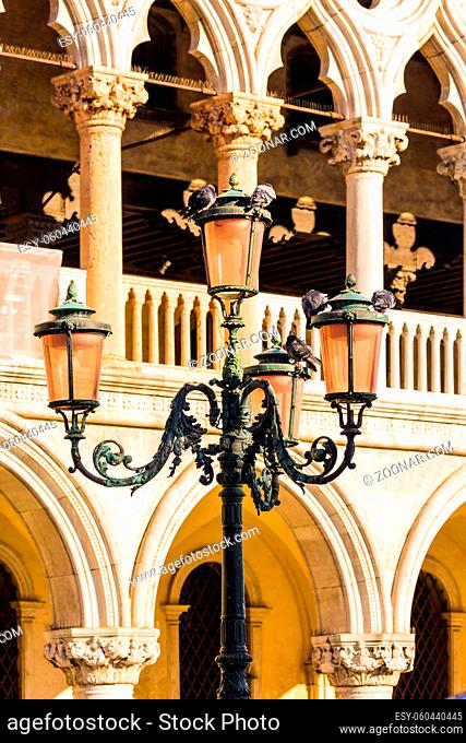 Palazzo Ducale in Piazza San Marco. Decorative street lamps and facade decorative elements. Doge's Palace. Magical journey to Venice