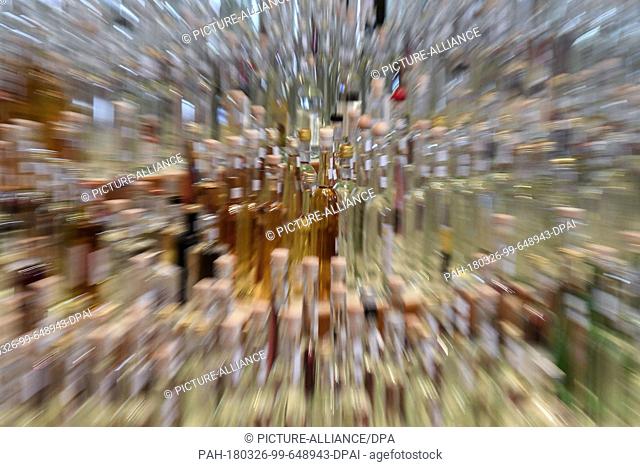 26 March 2018, Germany, Sasbachwalden: Hundreds of spirit bottles during a spirits award by the Association of Baden's small distillers and fruit distillers