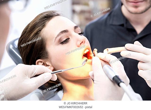 Young woman at the dentist receiving treatment