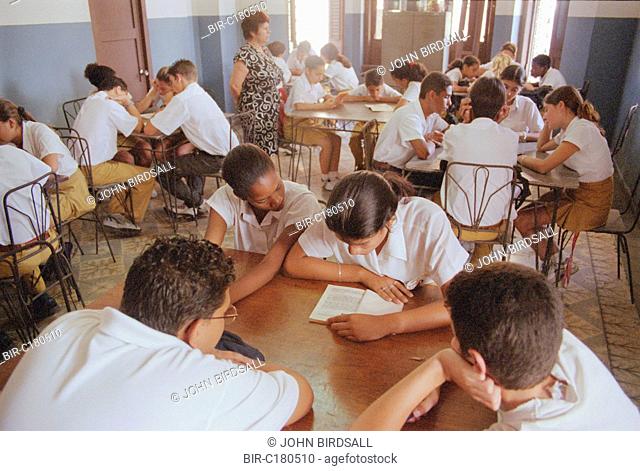 Secondary school children studying in classroom