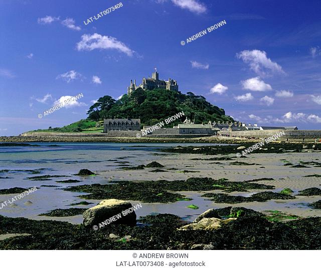 St Michael's Mount, a town built on the granite outcrop off shore linked to mainland by a natural causeway only passable at low tide
