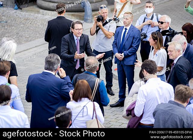 17 June 2020, Berlin: Andreas Scheuer (2nd from left, CSU), Federal Minister of Transport, speaks to industry representatives and journalists during a protest...