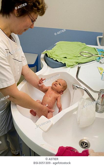 Photo essay at the maternity of Saint-Vincent de Paul hospital, Lille, France. Washing of the newborn baby