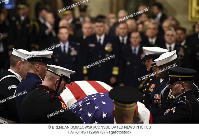 The casket bearing the remains of former US President George H.W. Bush arrives at the US Capitol during the State Funeral in Washington, DC, December 3, 2018