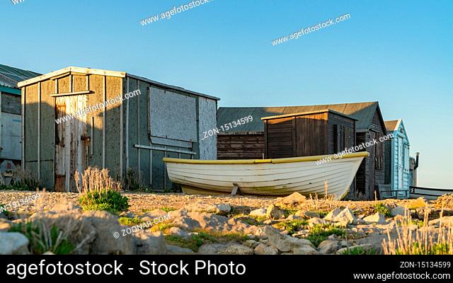 Portland Bill, Jurassic Coast, Dorset, UK - April 22, 2017: The fisherman's huts with a fishing boat