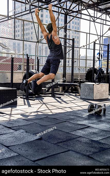 Man doing Calisthenics at rooftop gym