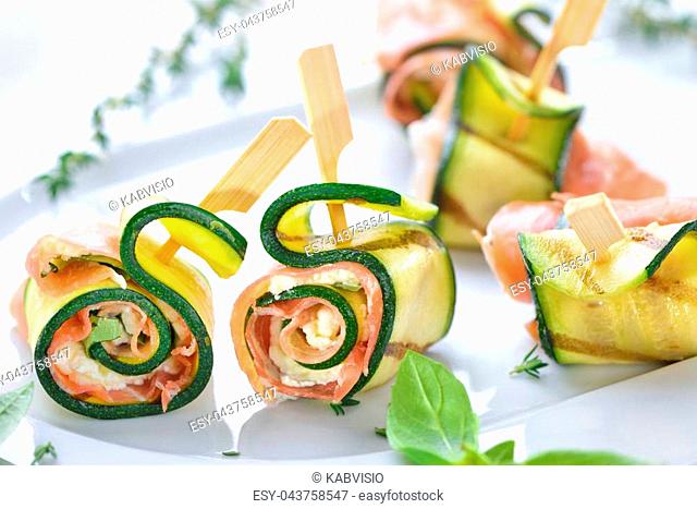 Zucchini appetizer rolls with delicious Italian ham and cream cheese with basil