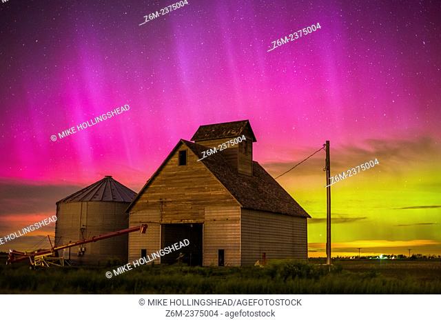 Nothern lights dance above the Iowa landscape