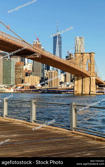 view from dumbo over the east river to lower manhattan with brooklyn bridge and one world trade center, new york city, usa