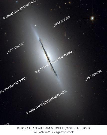 GALAXY NGC 5866 -- Feb 2006 -- This is a unique view of the disk galaxy NGC 5866 tilted nearly edge-on to our line-of-sight