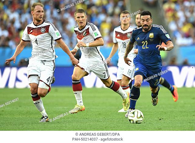 Benedikt Hoewedes (L), Bastian Schweinsteiger (C) of Germany and Ezequiel Lavezzi (R) of Argentina vie for the ball during the FIFA World Cup 2014 final soccer...