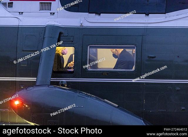 US President Joe Biden (R) and First Lady Jill Biden (L) are seen on Marine One as they arrive at George Washington’s Mount Vernon home to attend the National...
