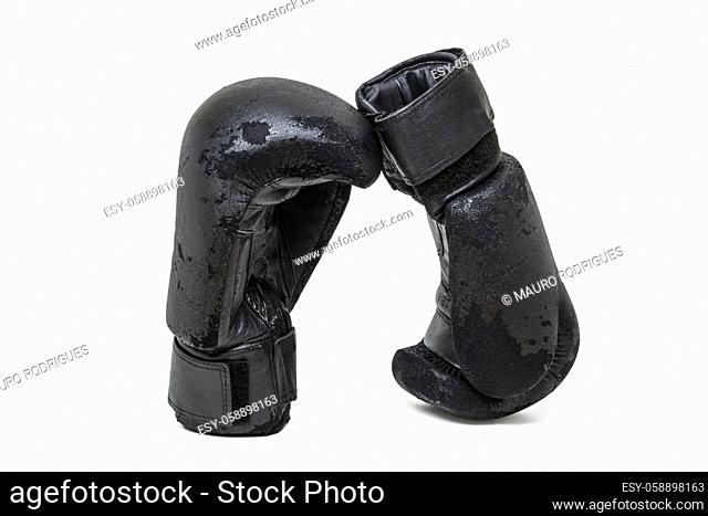 Close up view of a pair of used boxing gloves isolated on a white background