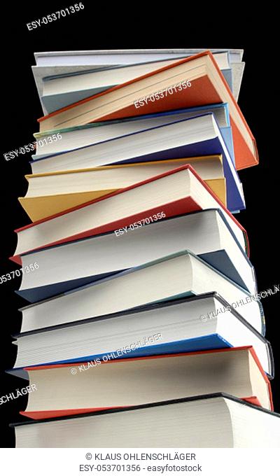 A stack of books in front of black background