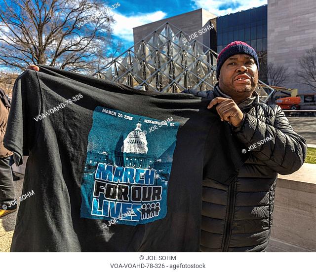 MARCH 24, 2018: Washington, D.C. African American sells t-shirt on Pennsylvania Avenue at 'March for Our Lives' Rally and Protest, Washington D.C