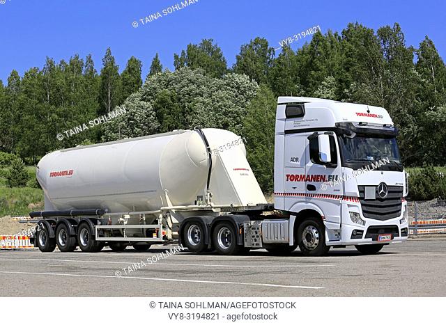 Salo, Finland - June 1, 2018: White Mercedes-Benz Actros 2651 semi tanker of Tormanen. eu for bulk transport parked on truck stop yard in summer