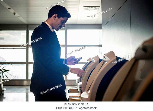 Businessman at airport check in area
