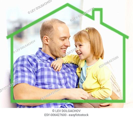 family, childhood, ecology and happiness concept - smiling father and daughter together at home behind green house symbol