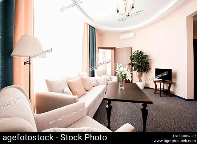 Hotel apartment, bedroom interior in the morning. two-room Suite, with large double bed