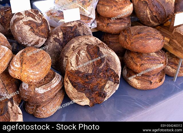 Freshly baked rustic rye granary bread on a food market stall