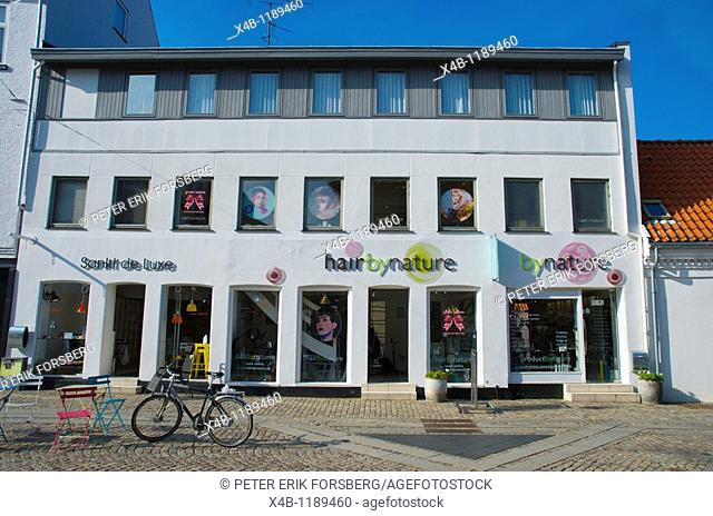 Hair saloon and shops along Algade main pedestrian street Roskilde Denmark Europe