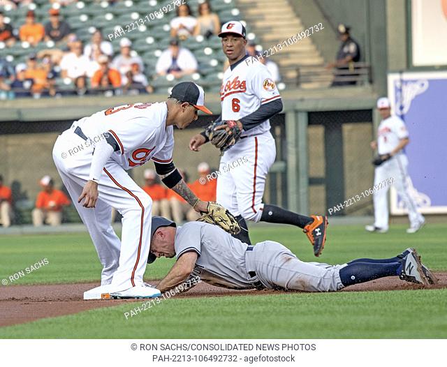 New York Yankees left fielder Brett Gardner (11) steals second base as he beats the tag from Baltimore Orioles shortstop Manny Machado (13) in the first inning...
