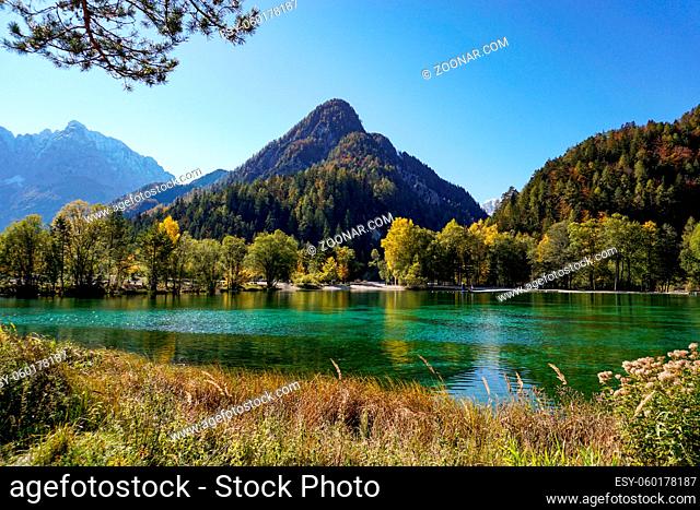 A view of Lake Jasna with forest and mountain landscape in beautiful autumn colors