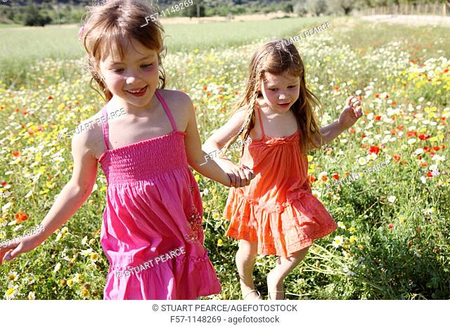 Two little girls in meadow