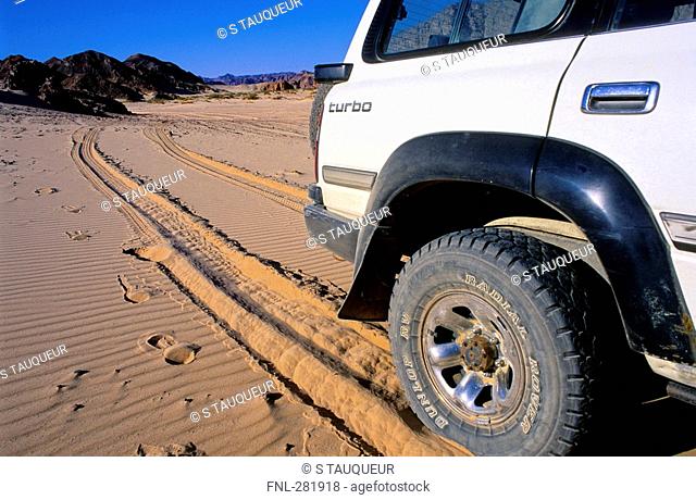 Jeep parked in desert, Sinai Desert, Egypt