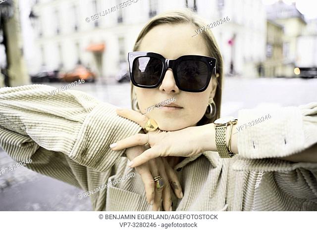 fashionable woman at street during fashion week, in Paris, France