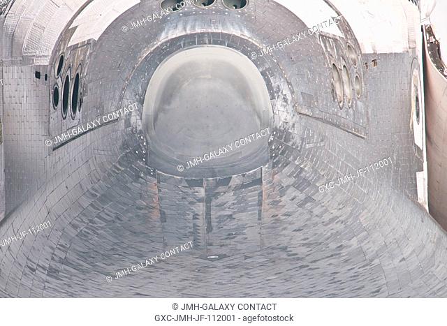 This unique view of the nose and forward underside of the space shuttle Discovery was provided by an Expedition 26 crew member during a survey of the...