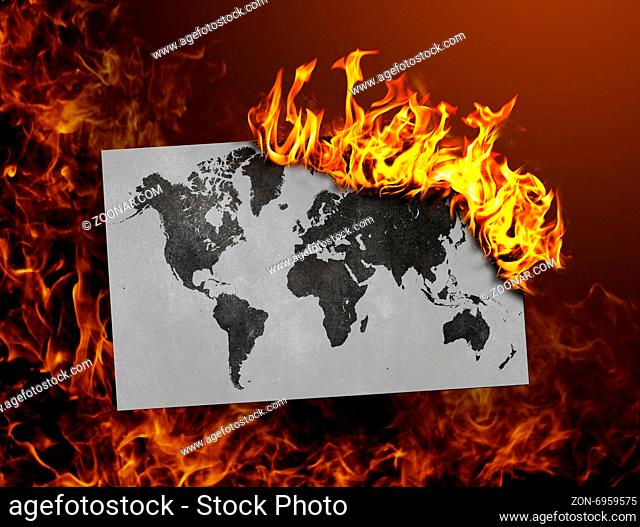 Flag burning - concept of war or crisis - world map