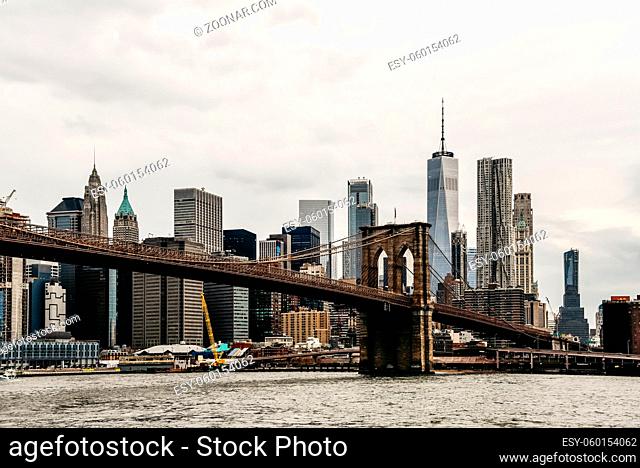 Panoramic view of Brooklyn bridge and financial District of New York from Brooklyn at evening