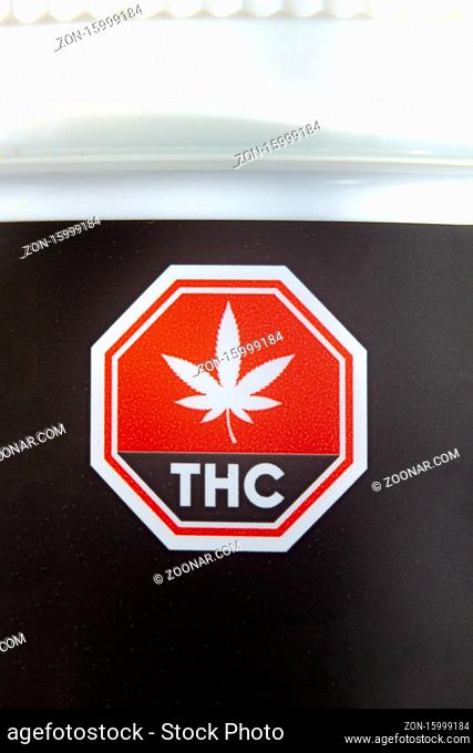Calgary, Alberta, Canada. Sep 02, 2020. Macro close up of the Standardized Cannabis Symbol on black cannabis container