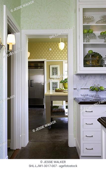 KITCHEN: Classic and modern mix, looking from butler's pantry into kitchen with moveable island, stainless steel professional refridgerator