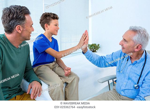 Doctor giving high five to a patient